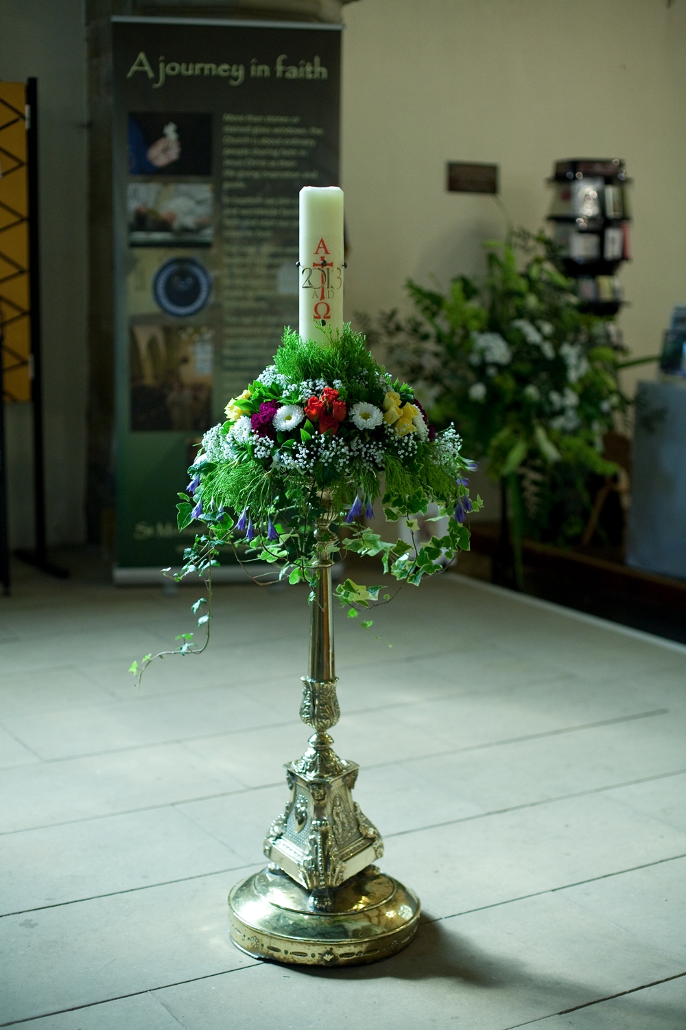 A flower-bedecked candle