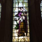 Stained glass window depicting "Charity" at St Peter the Fisherman, Craster