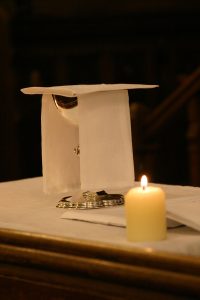 An image of a Communion chalice and candle taken at St Michael's Church