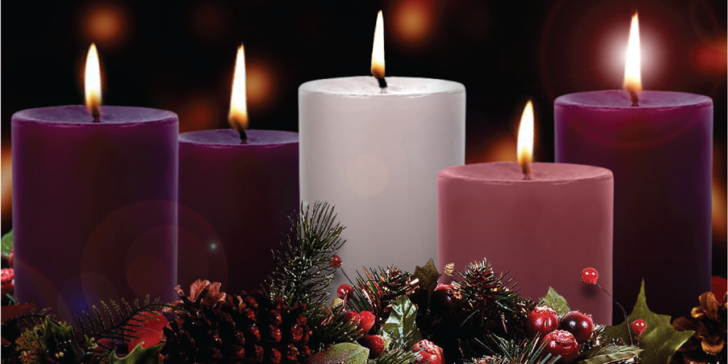 A photograph of three purple candles, a pink candle, and a white candle. All the candles are lit.